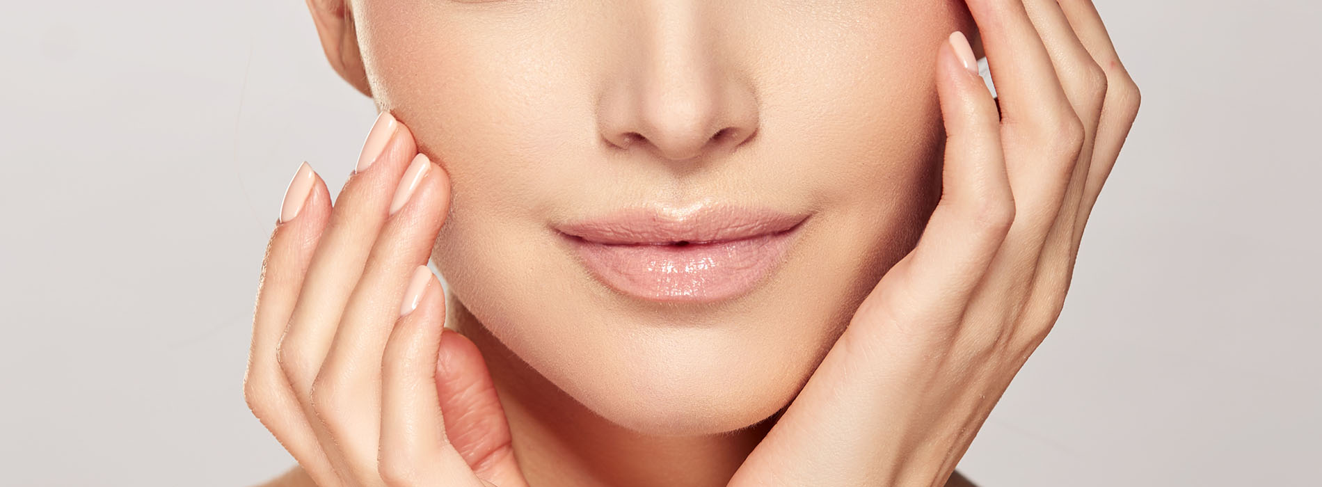 The image is a promotional advertisement featuring a woman with a clear complexion, showcasing her skin and the application of skincare products.